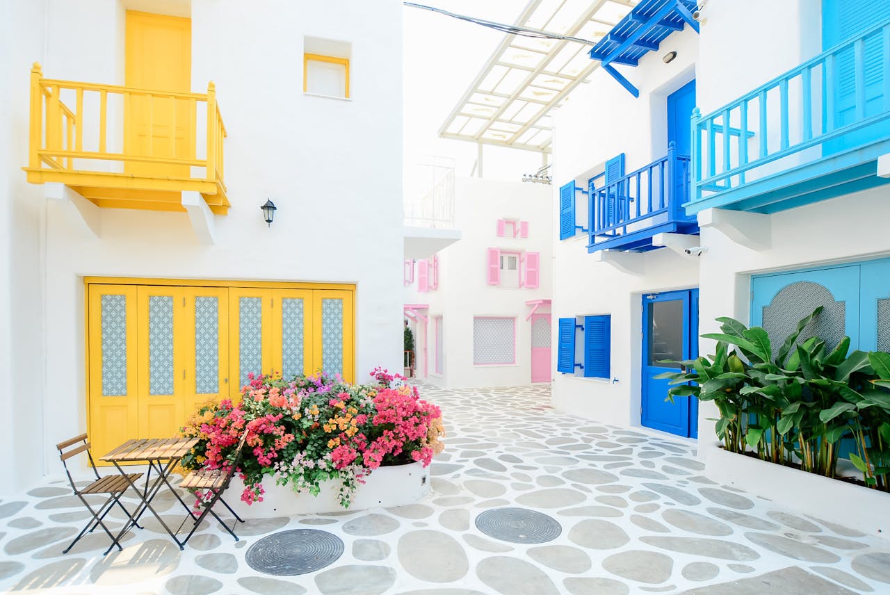 Vibrant Mediterranean architecture with colorful doors and balconies in Greece.